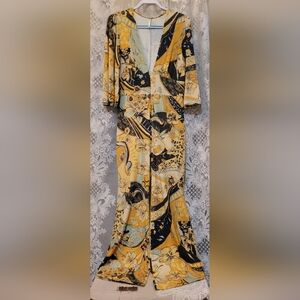 Free People Size M Vibrant Yellow and Black Floral Jumpsuit Deep Plunge Neckline
